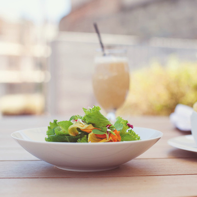 Salad and cocktail on the terrace of the Mercer Hotel Barcelona